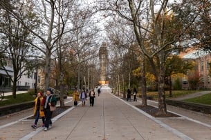 A photograph of students walking on Cornell University's campus. 