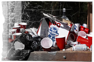 Beer cans and red drinking cups are scattered outside after drinking games.