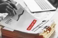 A illustration of a person looking at research paper with a "Fulbright" header and a "rejected" stamp on it.