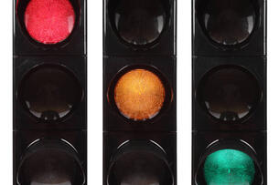 Traffic lights showing red, yellow and green