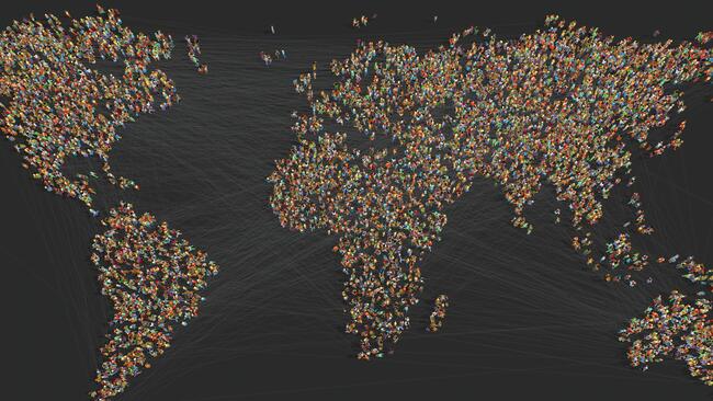An image of a world map made up of individual people.