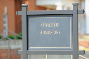 A campus sign that reads "Office of Admissions."