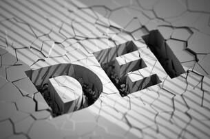 The letters DEI against the background of what appears to be a wall with many cracks.