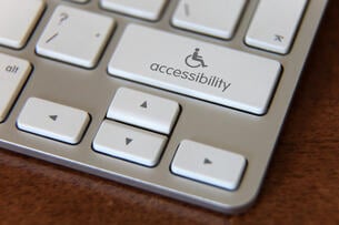 Accessibility computer icon on a keyboard of a laptop