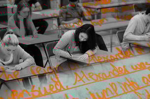 Students taking a written test with handwriting overlaid on top of it.