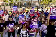 Loyola Marymount workers holding up signs for the union