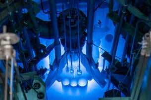 The glowing blue core of the MU Research Reactor. The image is very futuristic and sci-fi.