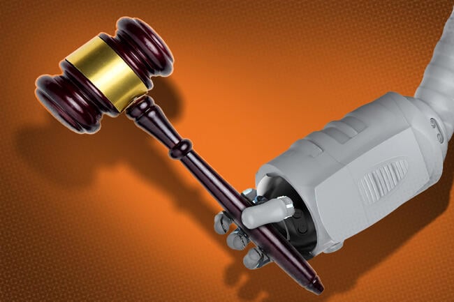 A robot arm holding a gavel.